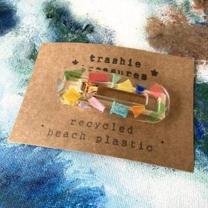 Rectangular hair clip with multi coloured recycled beach plastics.